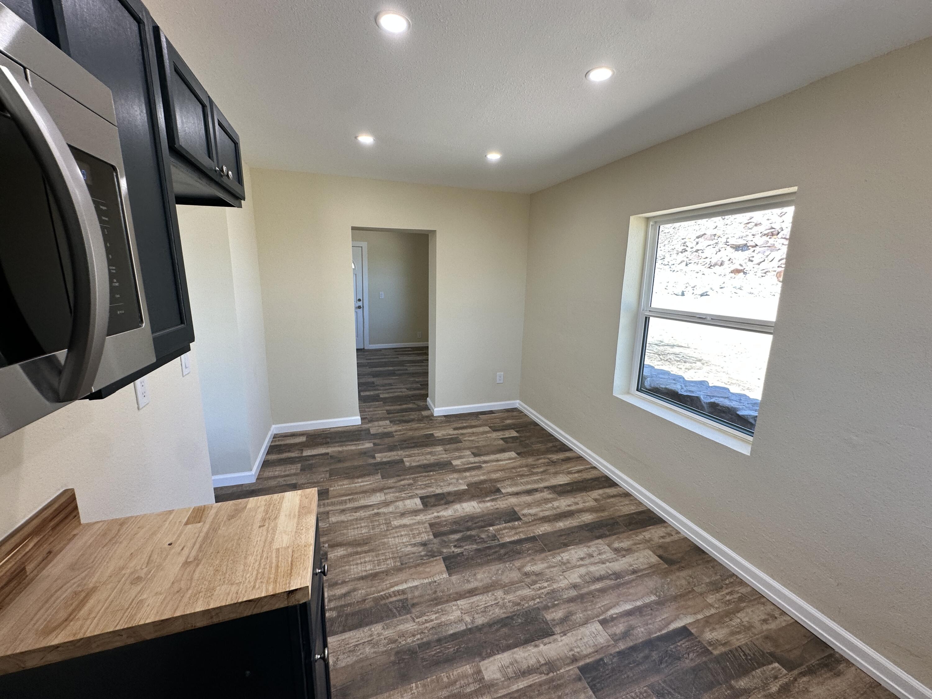 12164 B Street Trona, CA 93562 - Photo 11 of 41 a view of an empty room and wooden floor