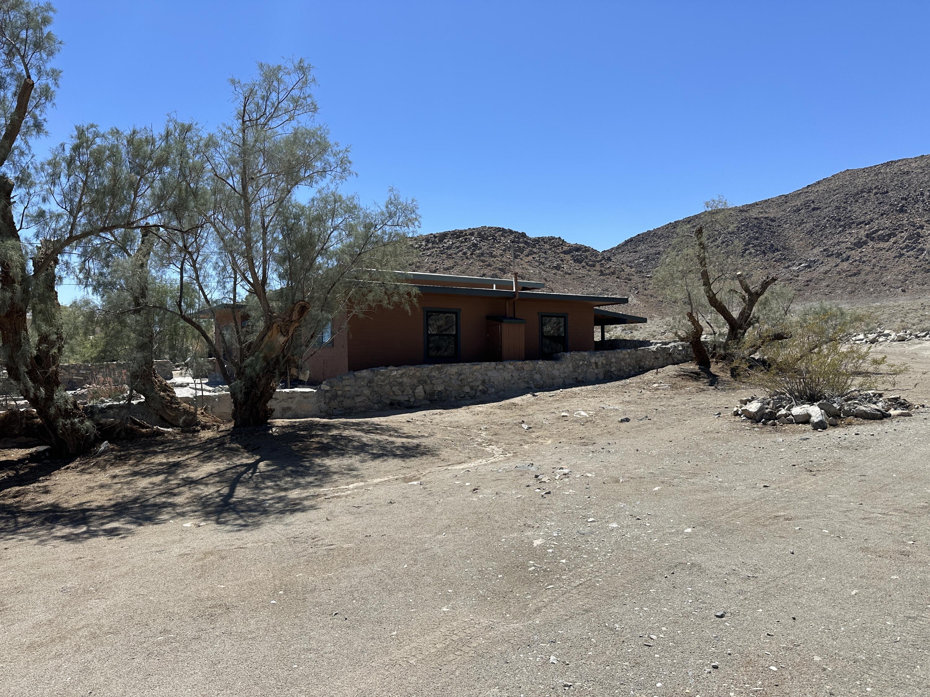 12164 B Street Trona, CA 93562 - Photo 22 of 41 a view of a house with a snow in the background
