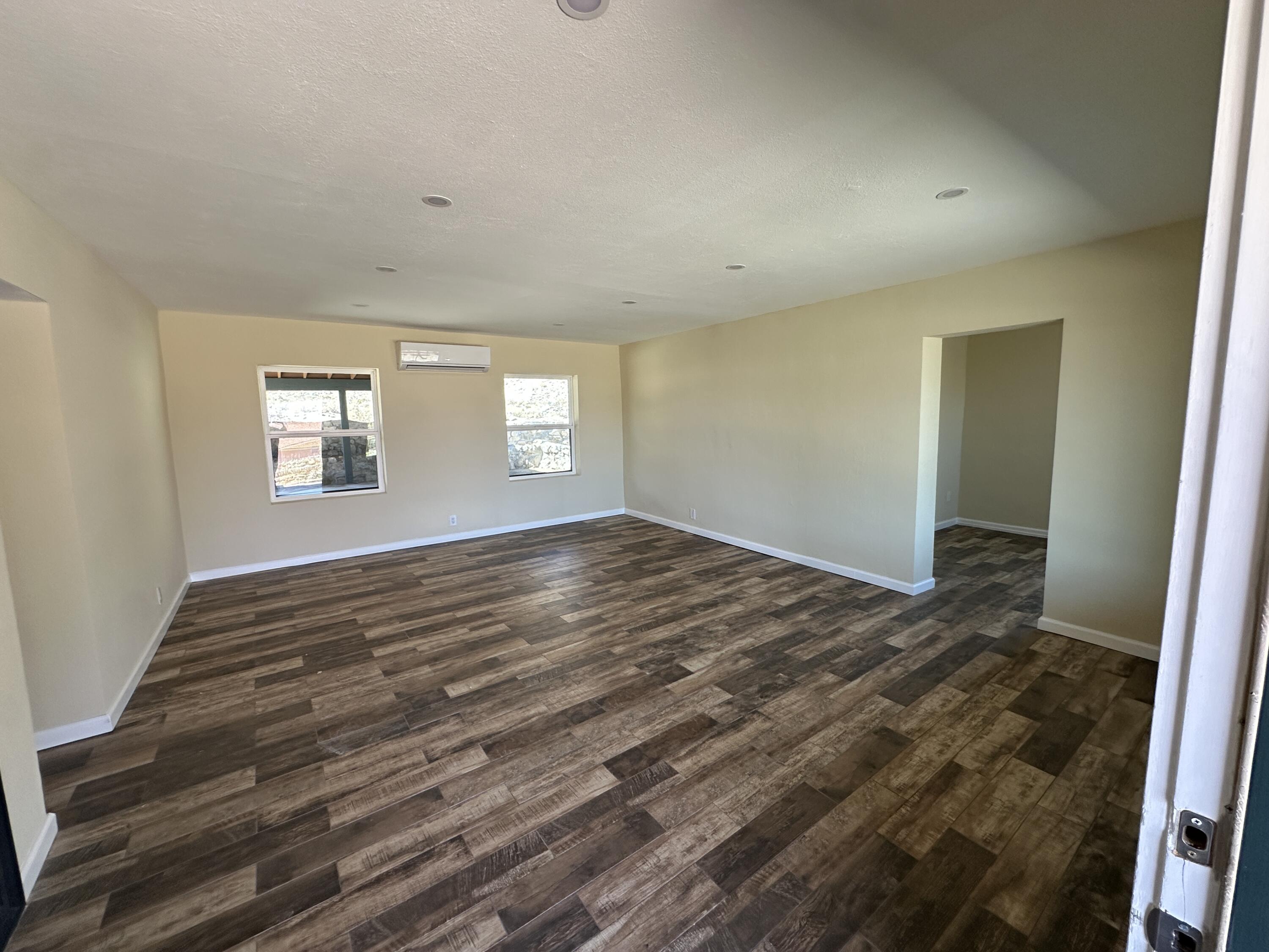 12164 B Street Trona, CA 93562 - Photo 3 of 41 a view of empty room with wooden floor and fan