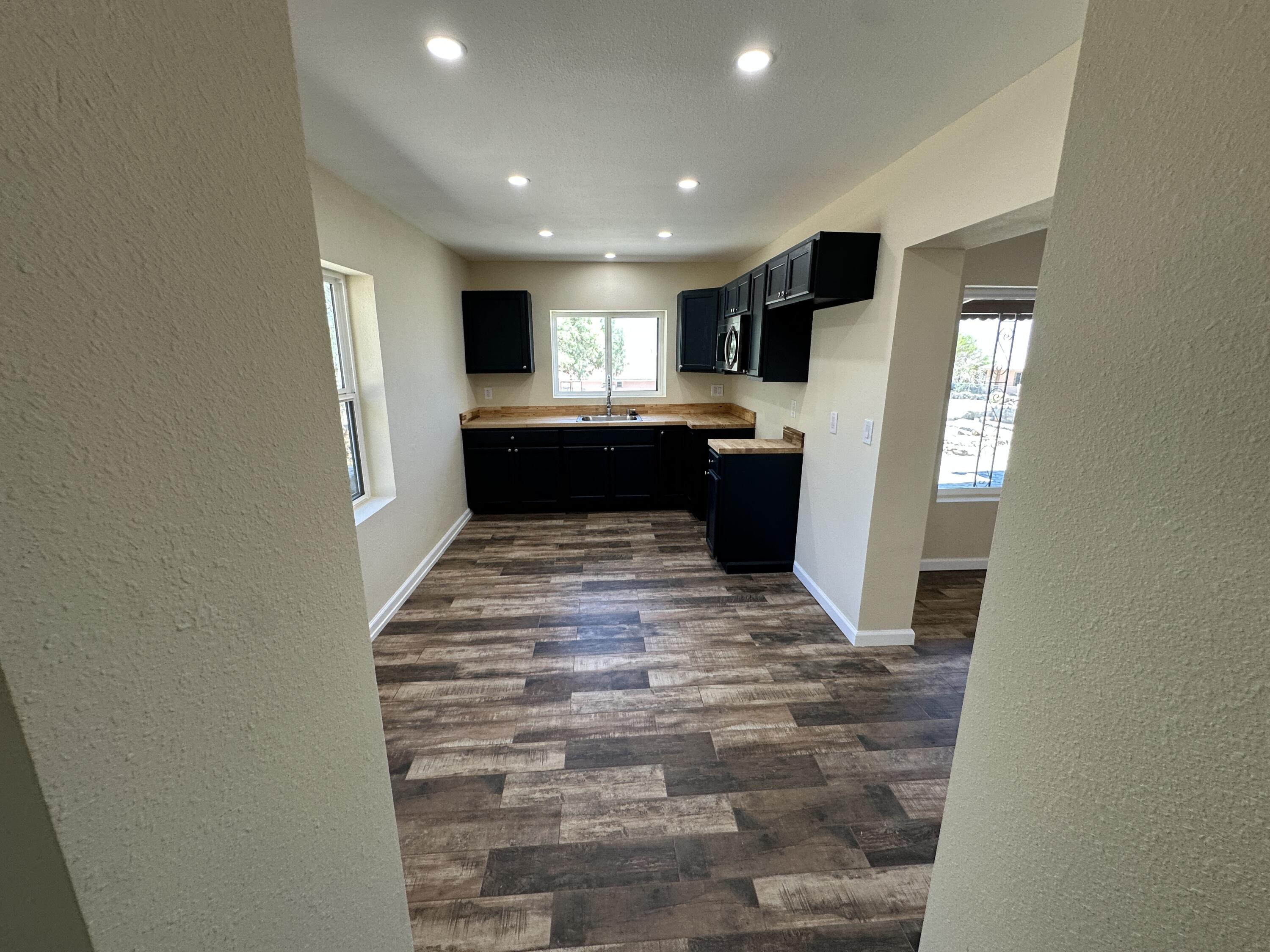 12164 B Street Trona, CA 93562 - Photo 8 of 41 a view of a hallway with a kitchen