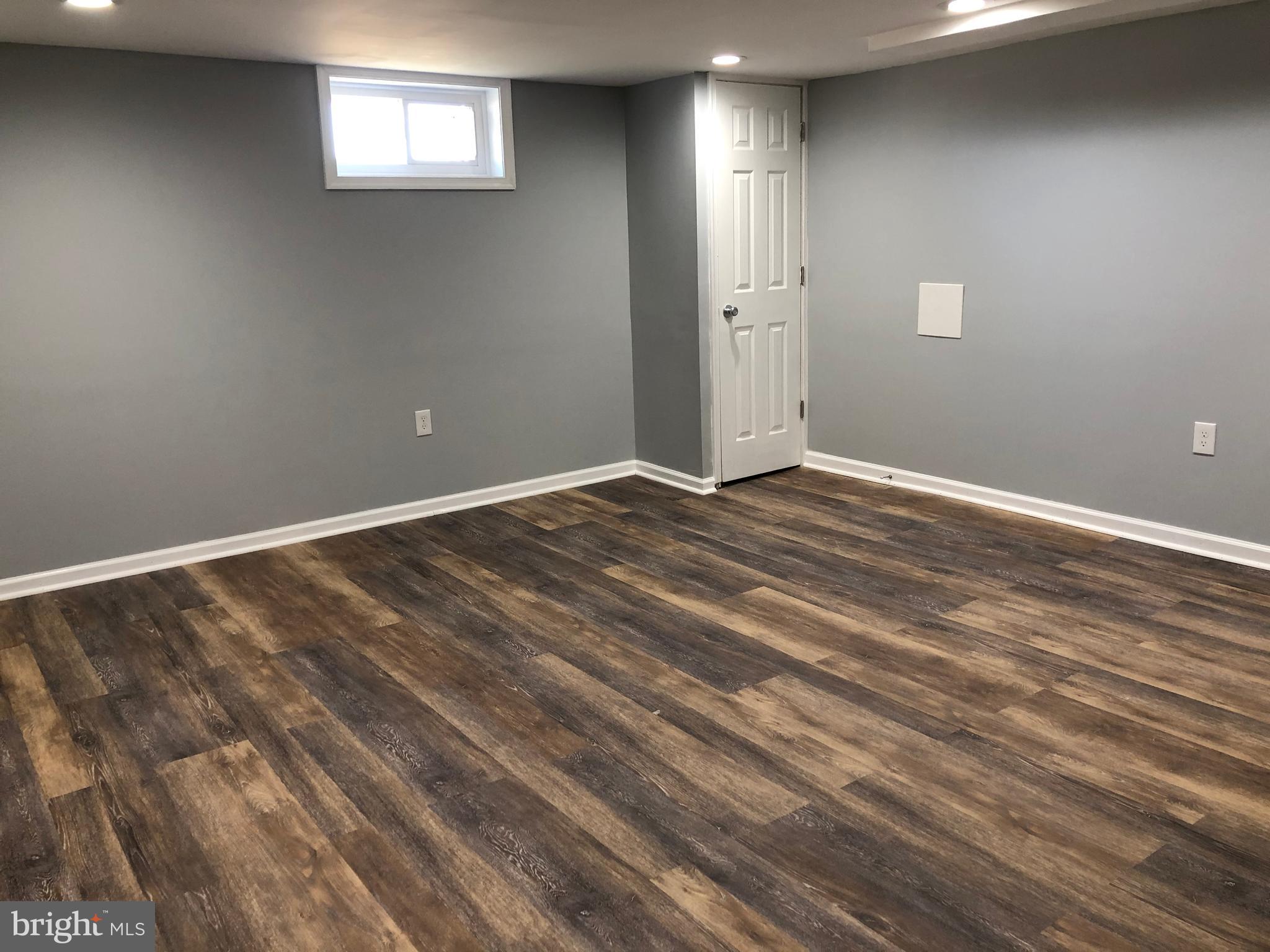 1650 Gleneagle Road Baltimore, MD 21239 - Photo 24 of 31 Huge family room with high end LVT flooring