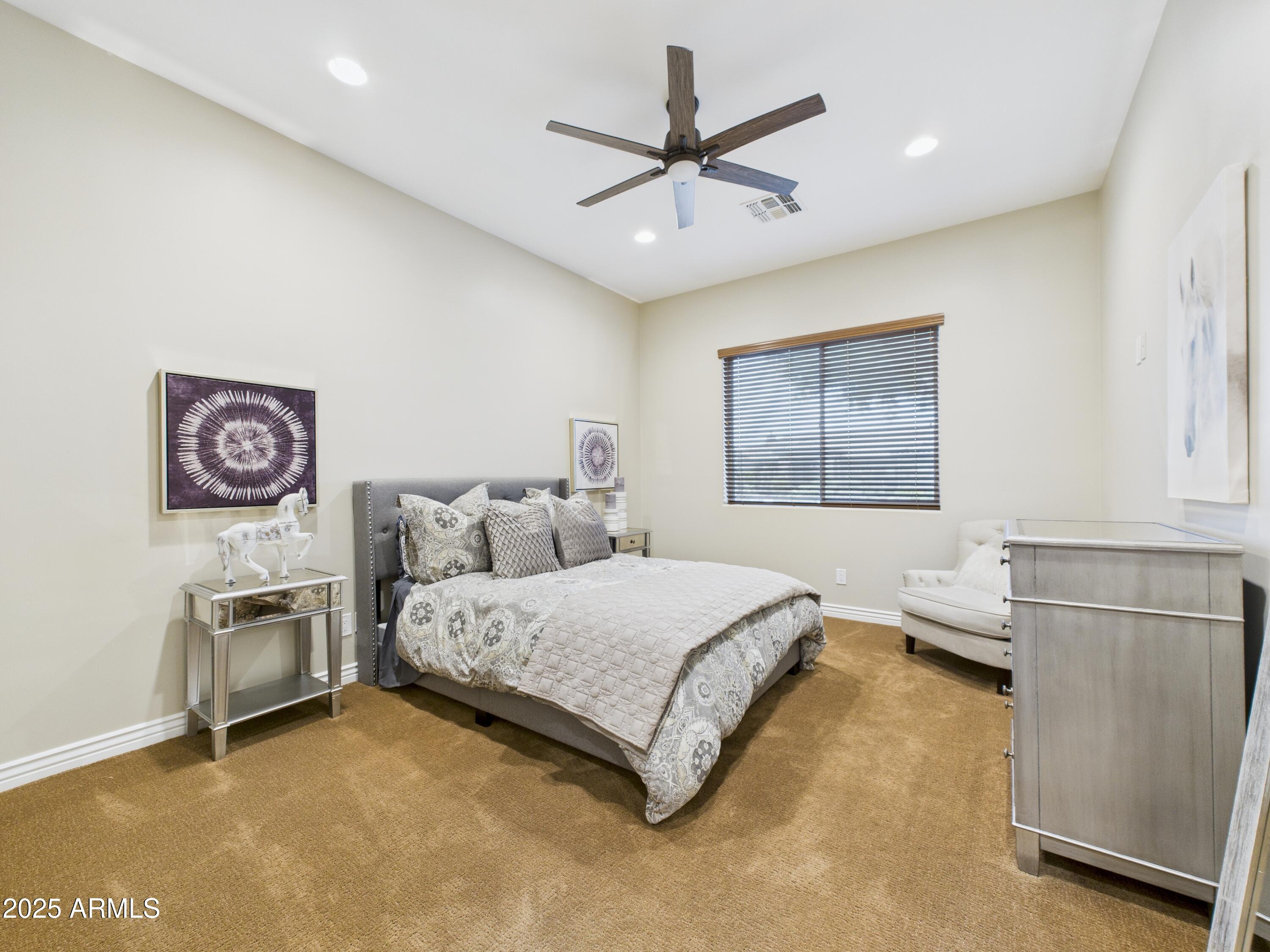 806 West Desert Ranch Road Phoenix, AZ 85086 - Photo 24 of 36 a bedroom with a bed furniture and a window