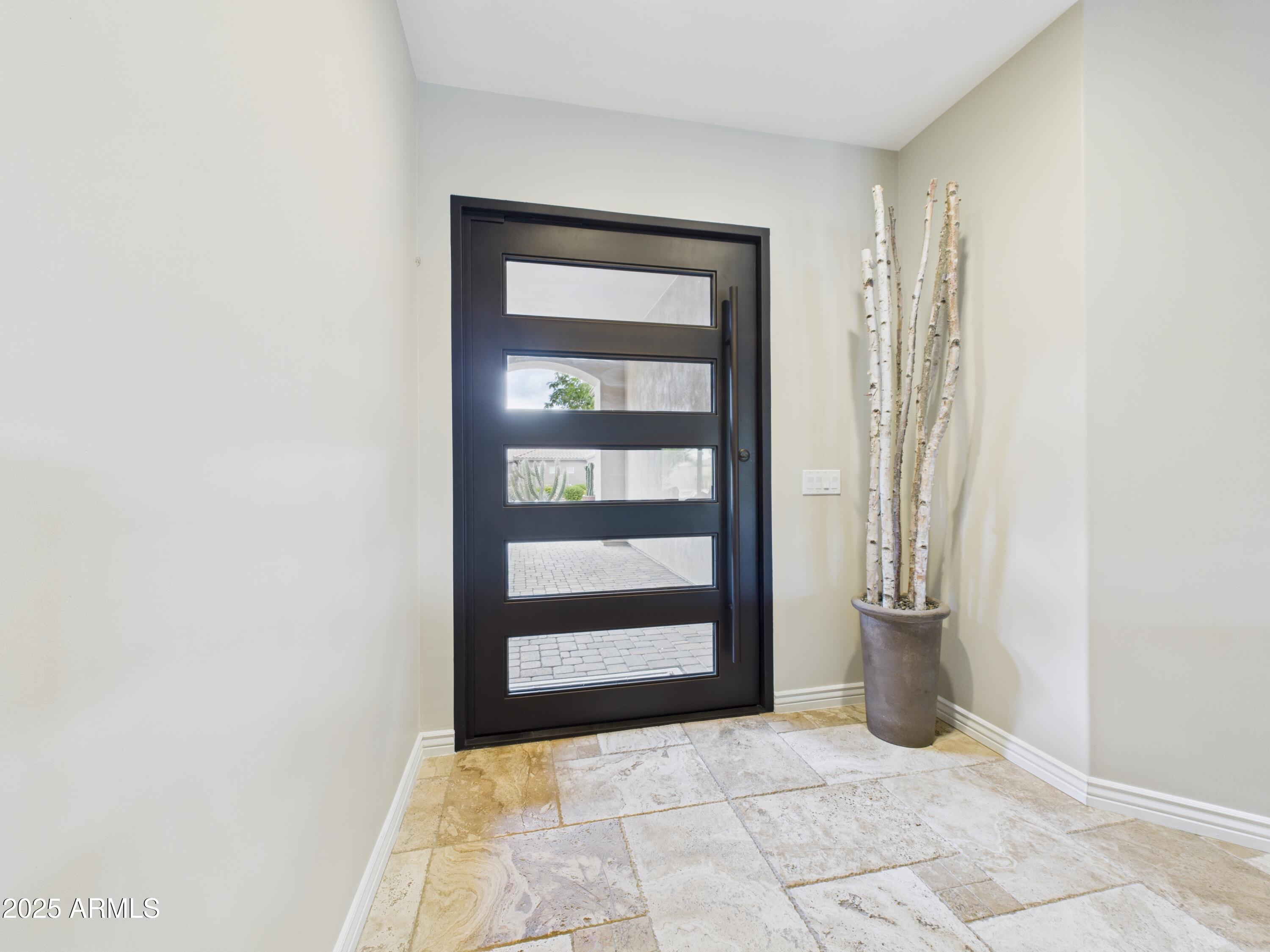 806 West Desert Ranch Road Phoenix, AZ 85086 - Photo 31 of 36 a view of an empty room with staircase and door