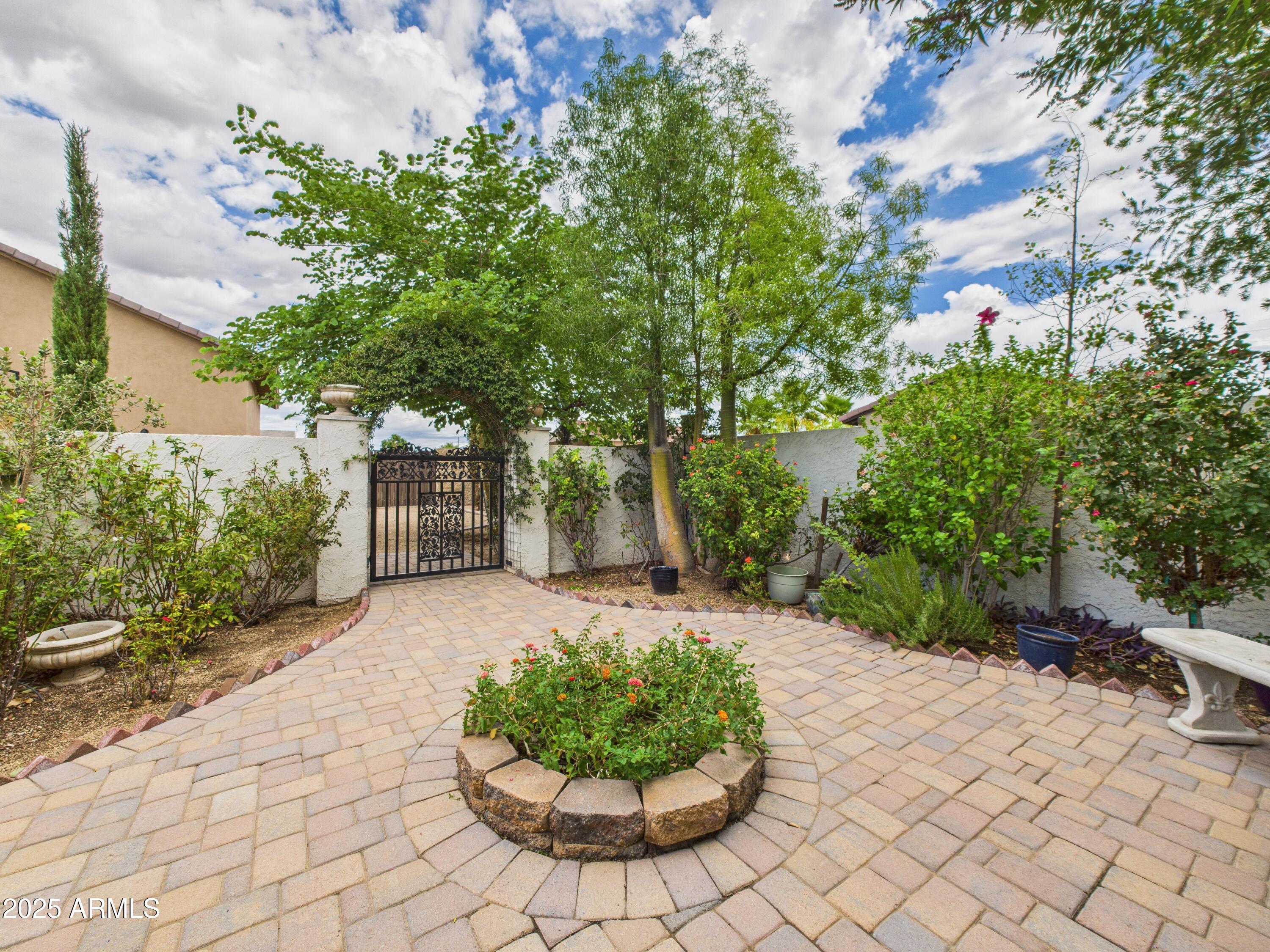 806 West Desert Ranch Road Phoenix, AZ 85086 - Photo 8 of 36 a view of a backyard with table and chairs and potted plants