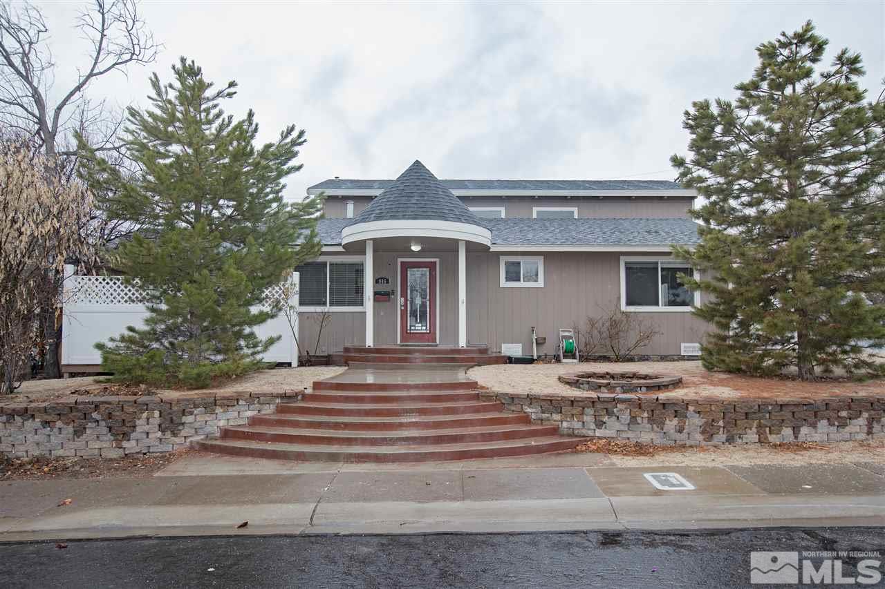 985 Akard Drive Reno, NV 89503 - Photo 1 of 25 a front view of a house with a yard