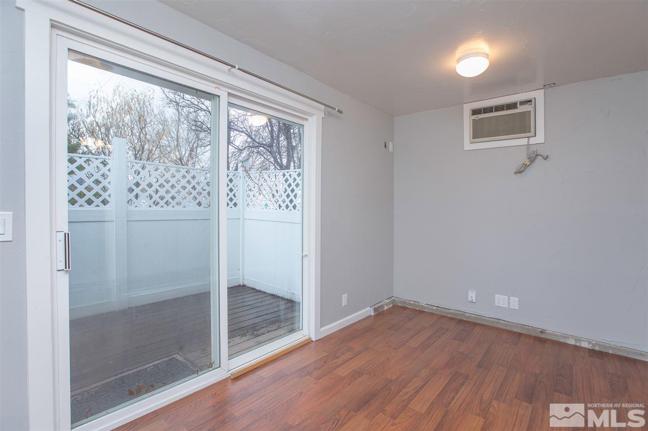 985 Akard Drive Reno, NV 89503 - Photo 13 of 25 a view of empty room with wooden floor and fan