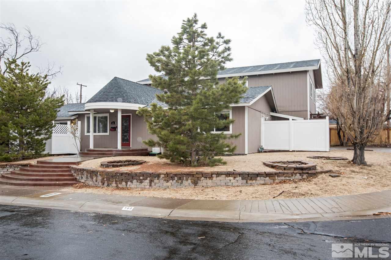 985 Akard Drive Reno, NV 89503 - Photo 2 of 25 a front view of a house with a yard and trees
