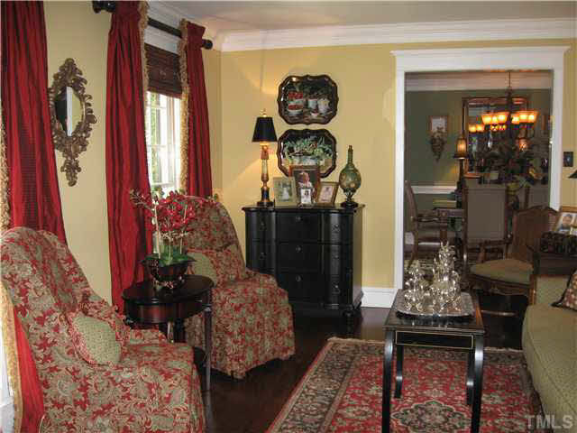 8809 Wellsley Way Raleigh, NC 27613 - Photo 10 of 25 Living room....hardwoods and crown...big windows for natural light..