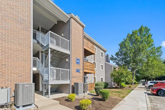 a front view of a building with street view