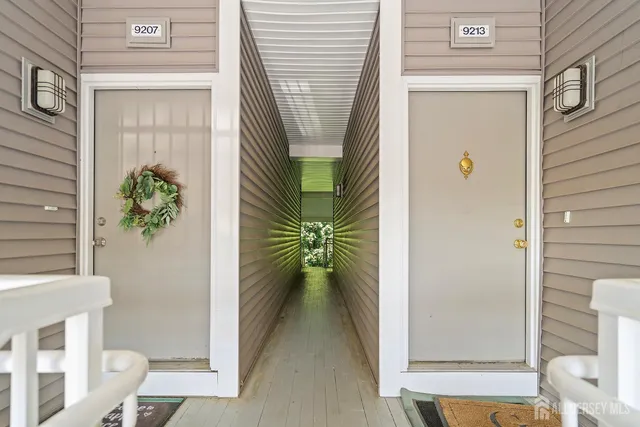 a view of balcony door and wooden door