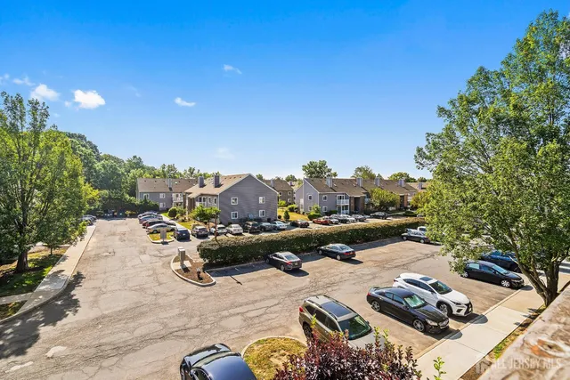 a view of a terrace with furniture and a garden
