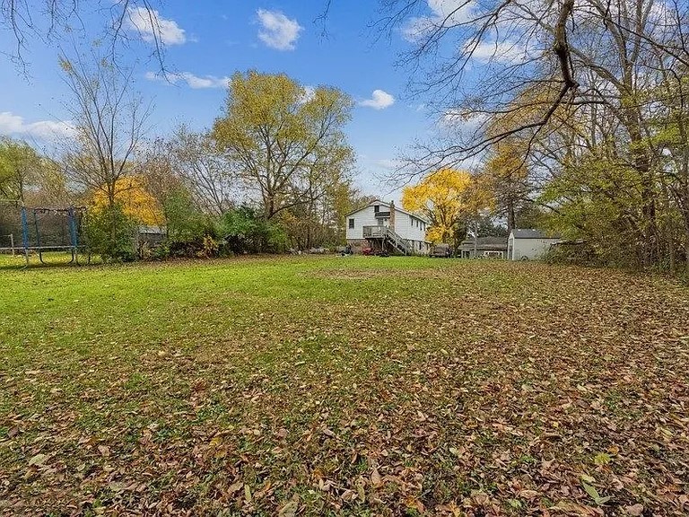330 Park Avenue Cary, IL 60013 - Photo 12 of 13 a view of a field with an trees