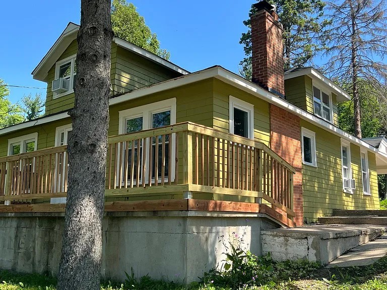 330 Park Avenue Cary, IL 60013 - Photo 2 of 13 a front view of a house with a yard