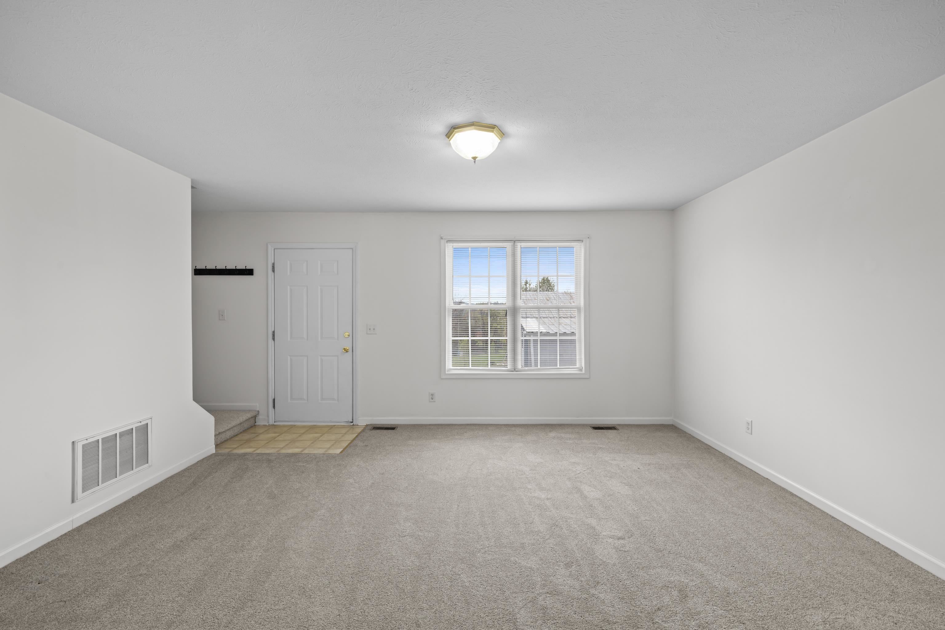 108 Pleasant Hill Road, Unit A & B Harrisonburg, VA 22801 - Photo 12 of 65 an empty room with a empty space and windows