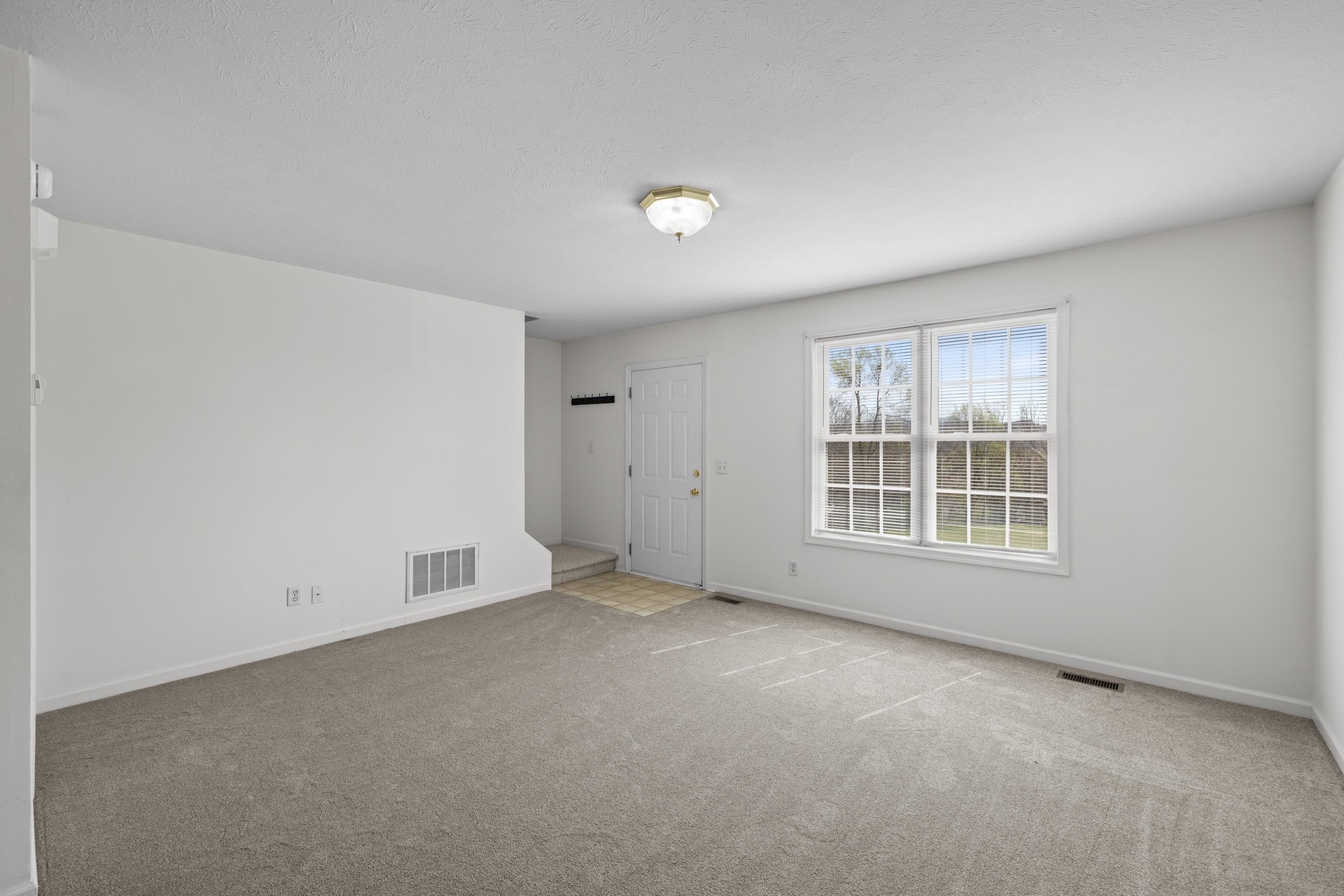 108 Pleasant Hill Road, Unit A & B Harrisonburg, VA 22801 - Photo 13 of 65 an empty room with a window