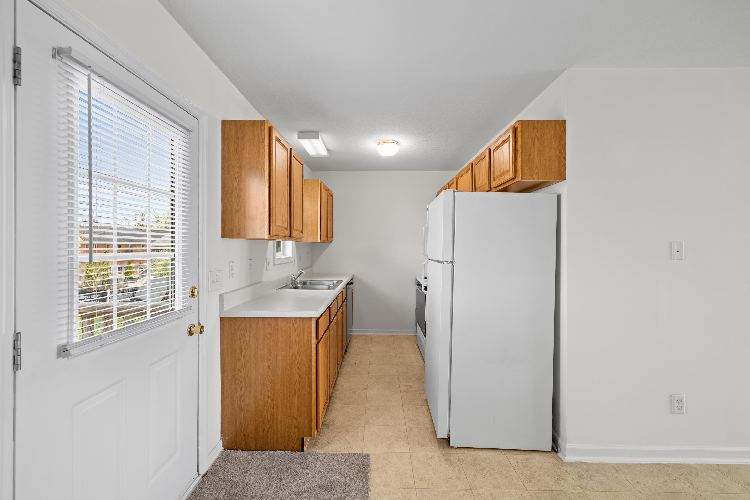 108 Pleasant Hill Road, Unit A & B Harrisonburg, VA 22801 - Photo 17 of 65 a view of a kitchen with a refrigerator a sink and dishwasher