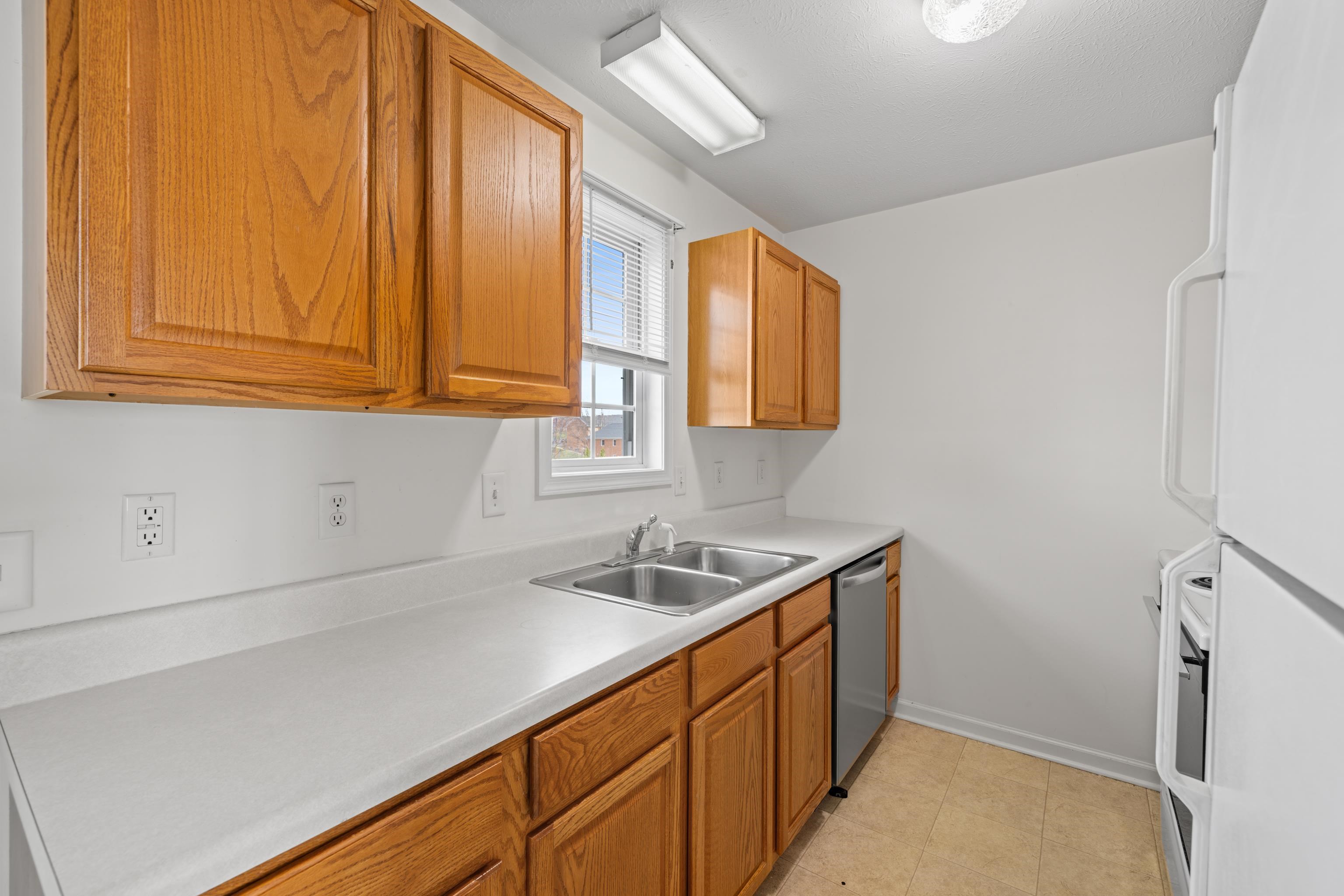 108 Pleasant Hill Road, Unit A & B Harrisonburg, VA 22801 - Photo 18 of 65 a kitchen with stainless steel appliances granite countertop a sink and a white cabinets