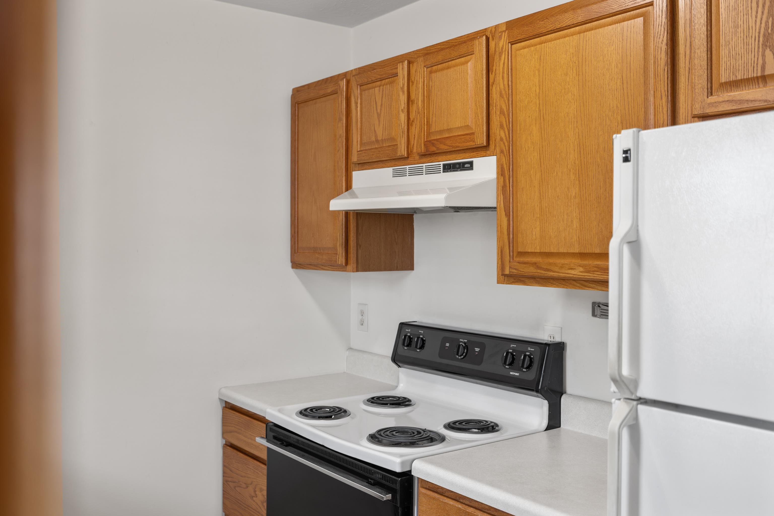 108 Pleasant Hill Road, Unit A & B Harrisonburg, VA 22801 - Photo 21 of 65 a kitchen with a stove and a refrigerator