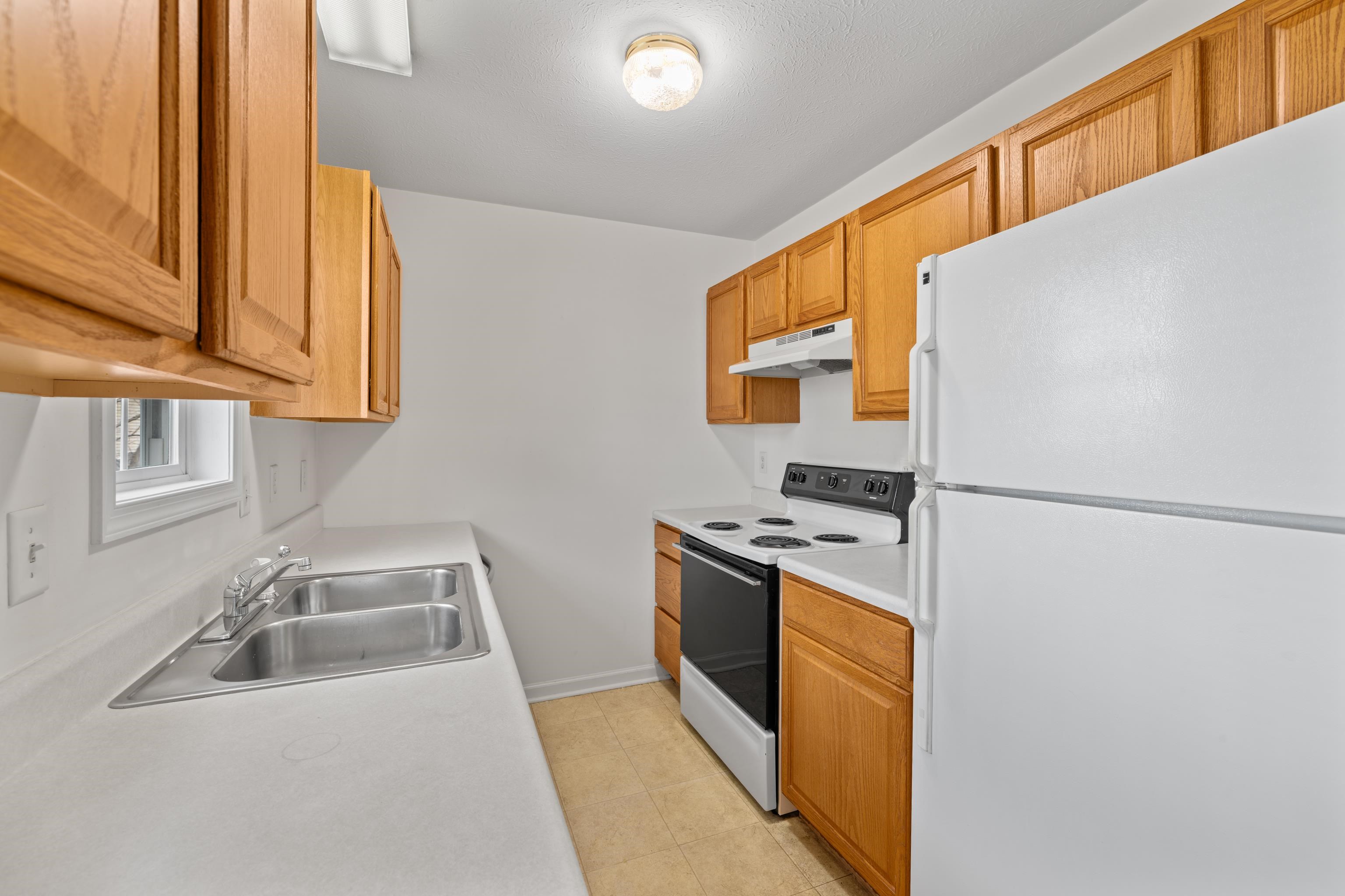 108 Pleasant Hill Road, Unit A & B Harrisonburg, VA 22801 - Photo 22 of 65 a kitchen with stainless steel appliances granite countertop a sink a stove a refrigerator with grey cabinets