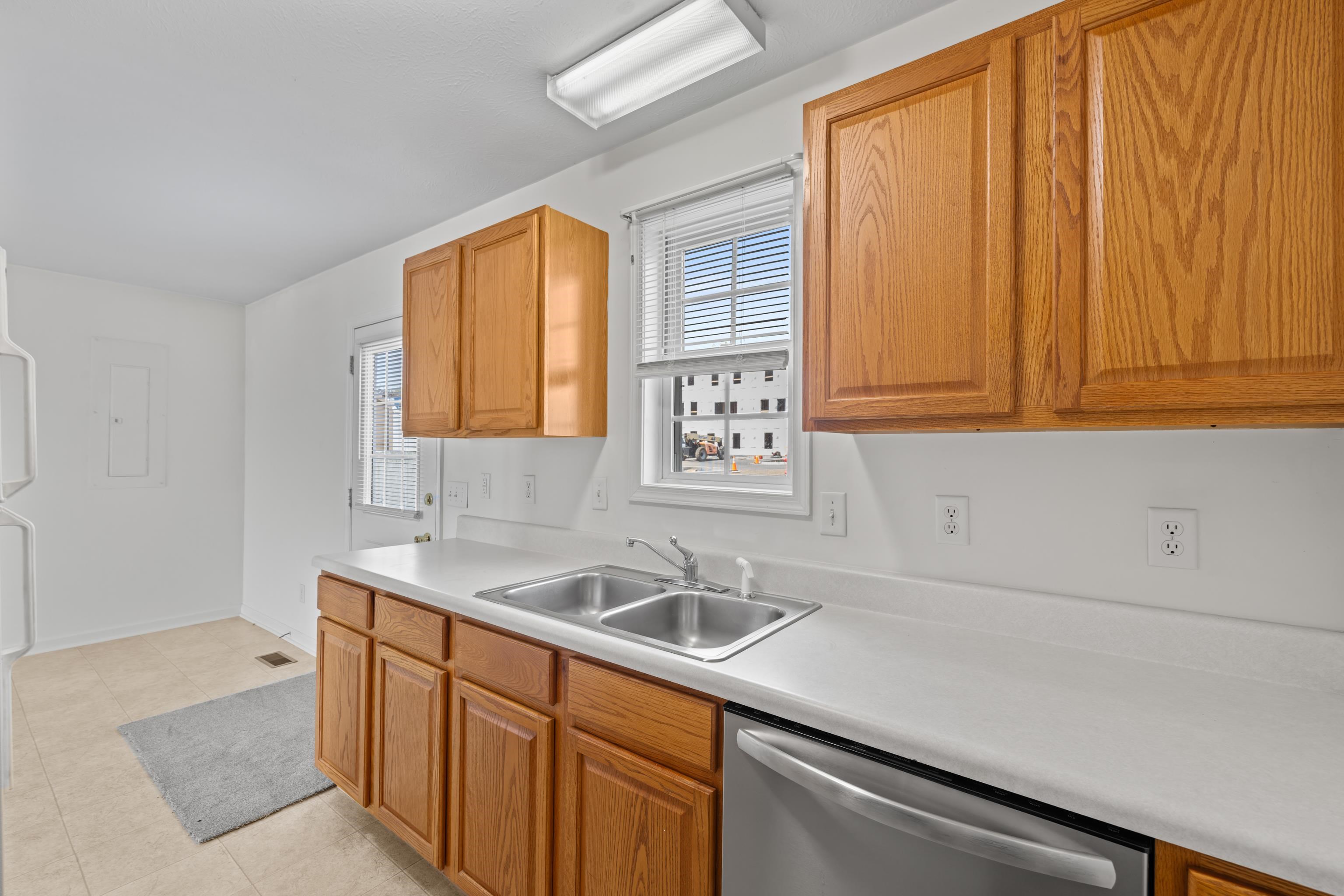 108 Pleasant Hill Road, Unit A & B Harrisonburg, VA 22801 - Photo 25 of 65 a kitchen with a sink cabinets and a window