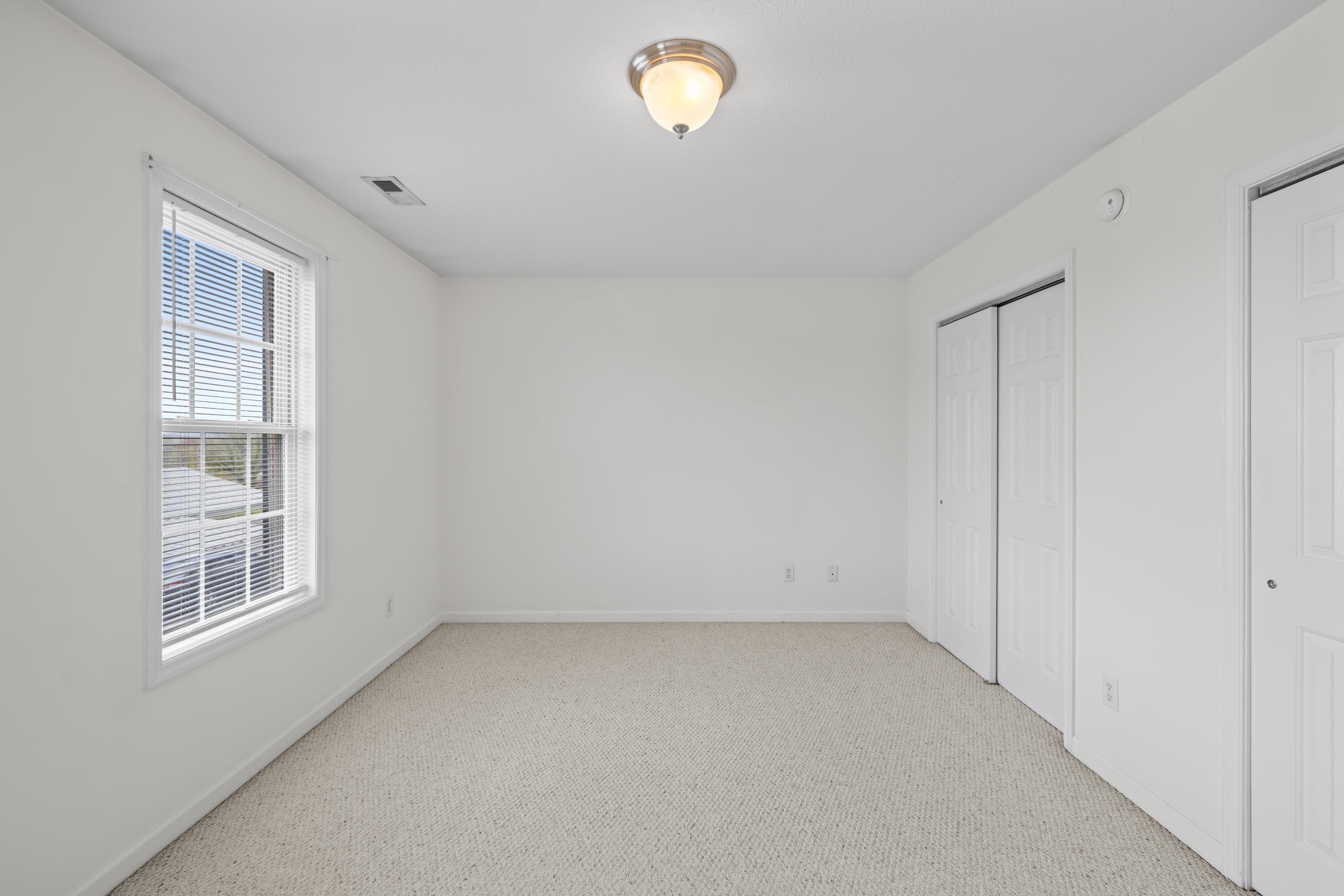 108 Pleasant Hill Road, Unit A & B Harrisonburg, VA 22801 - Photo 29 of 65 an empty room with windows
