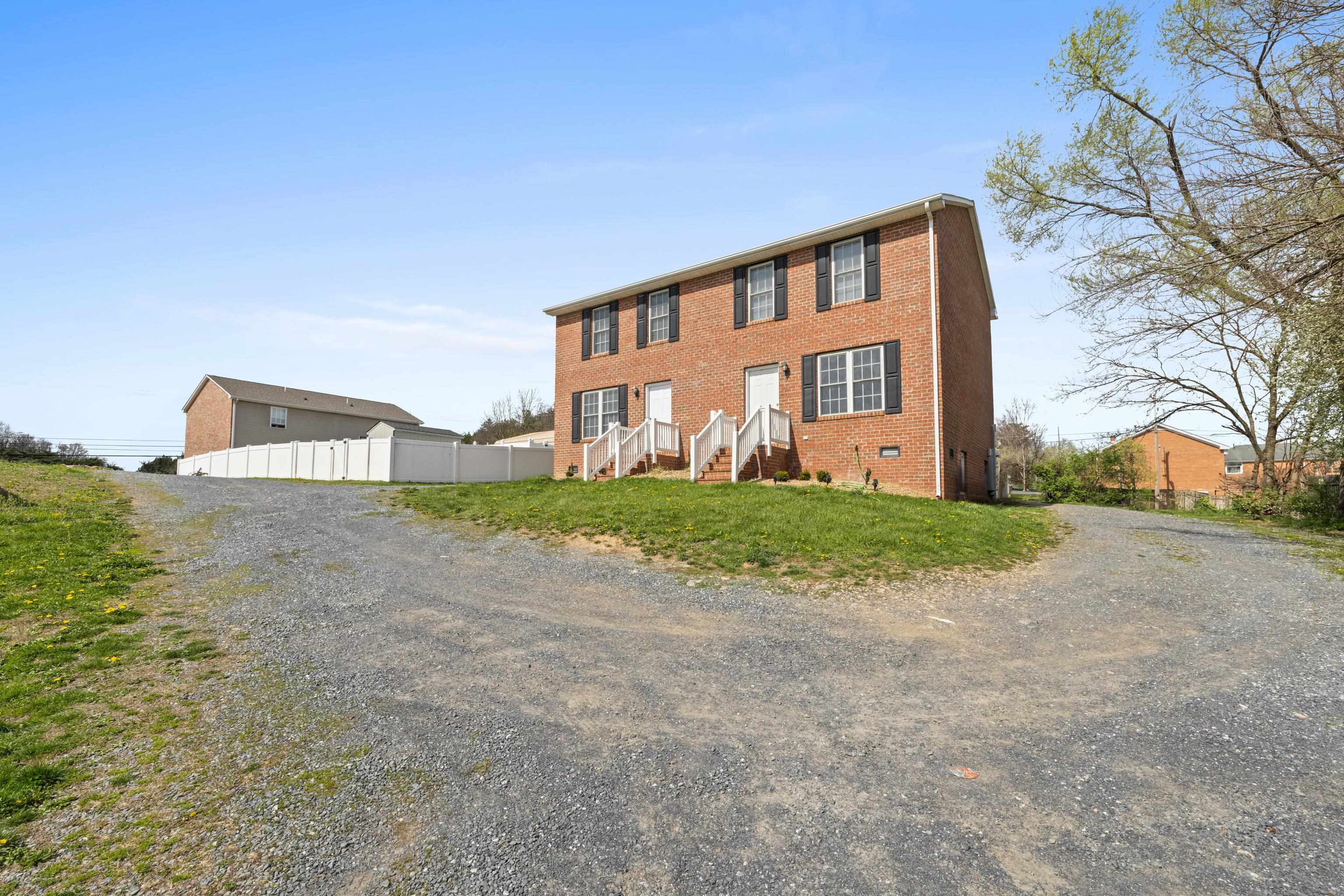 108 Pleasant Hill Road, Unit A & B Harrisonburg, VA 22801 - Photo 3 of 65 a view of a house with a yard and large tree