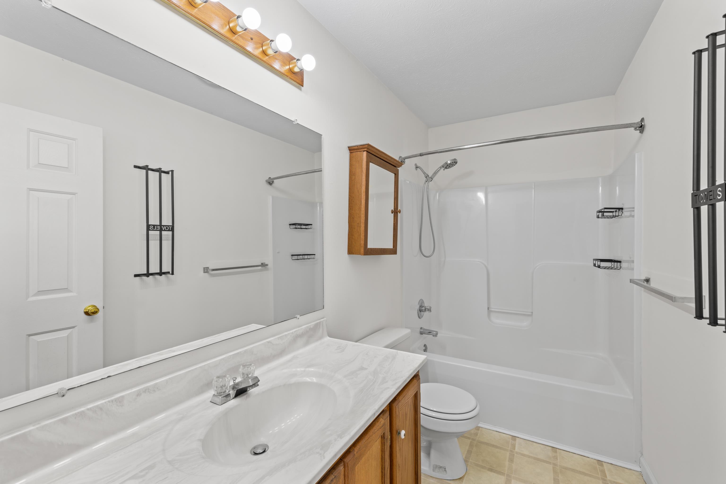 108 Pleasant Hill Road, Unit A & B Harrisonburg, VA 22801 - Photo 33 of 65 a bathroom with a sink a toilet and shower