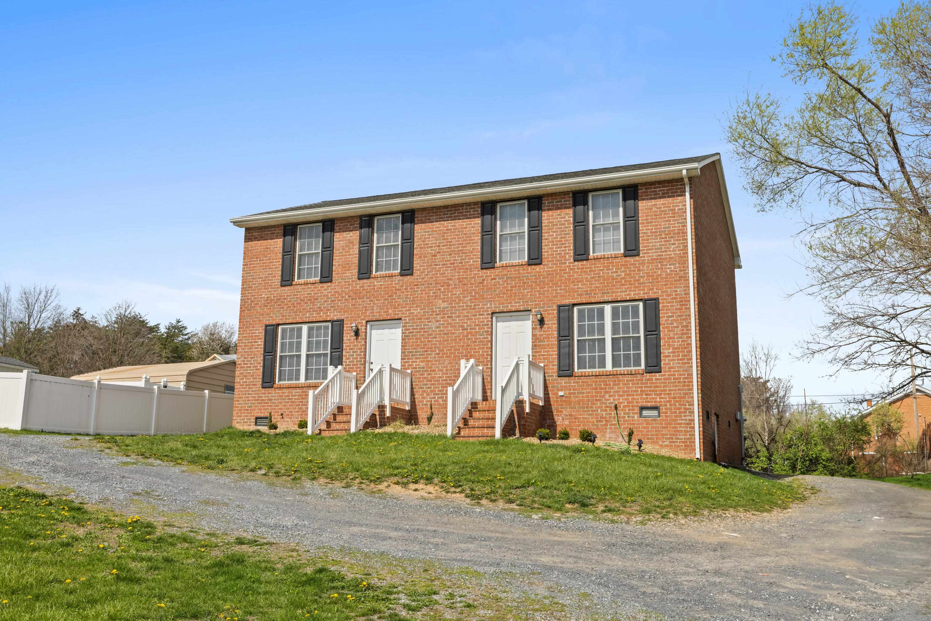 108 Pleasant Hill Road, Unit A & B Harrisonburg, VA 22801 - Photo 4 of 65 a front view of a house with garden
