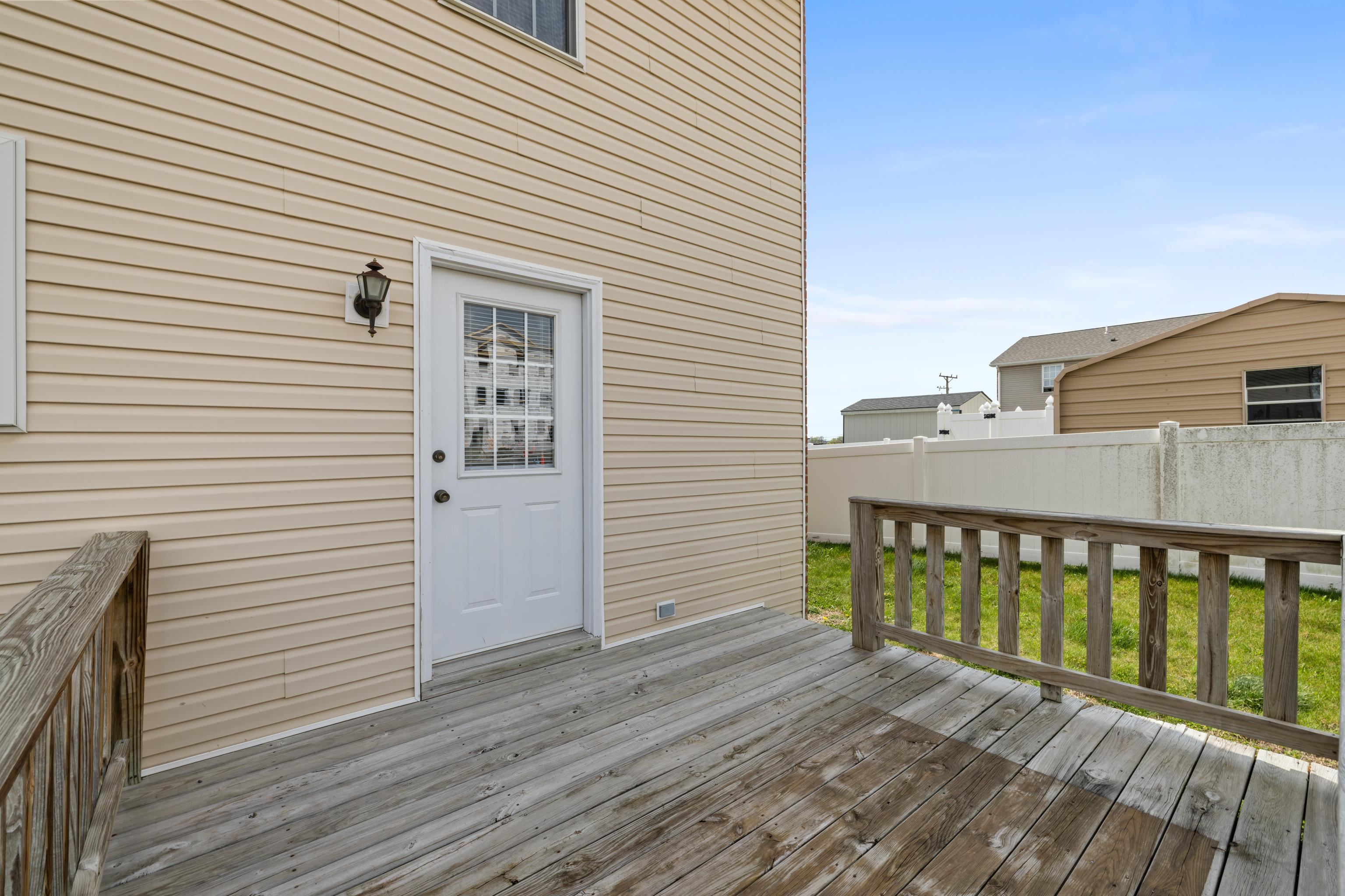 108 Pleasant Hill Road, Unit A & B Harrisonburg, VA 22801 - Photo 42 of 65 a view of a wooden deck with a yard