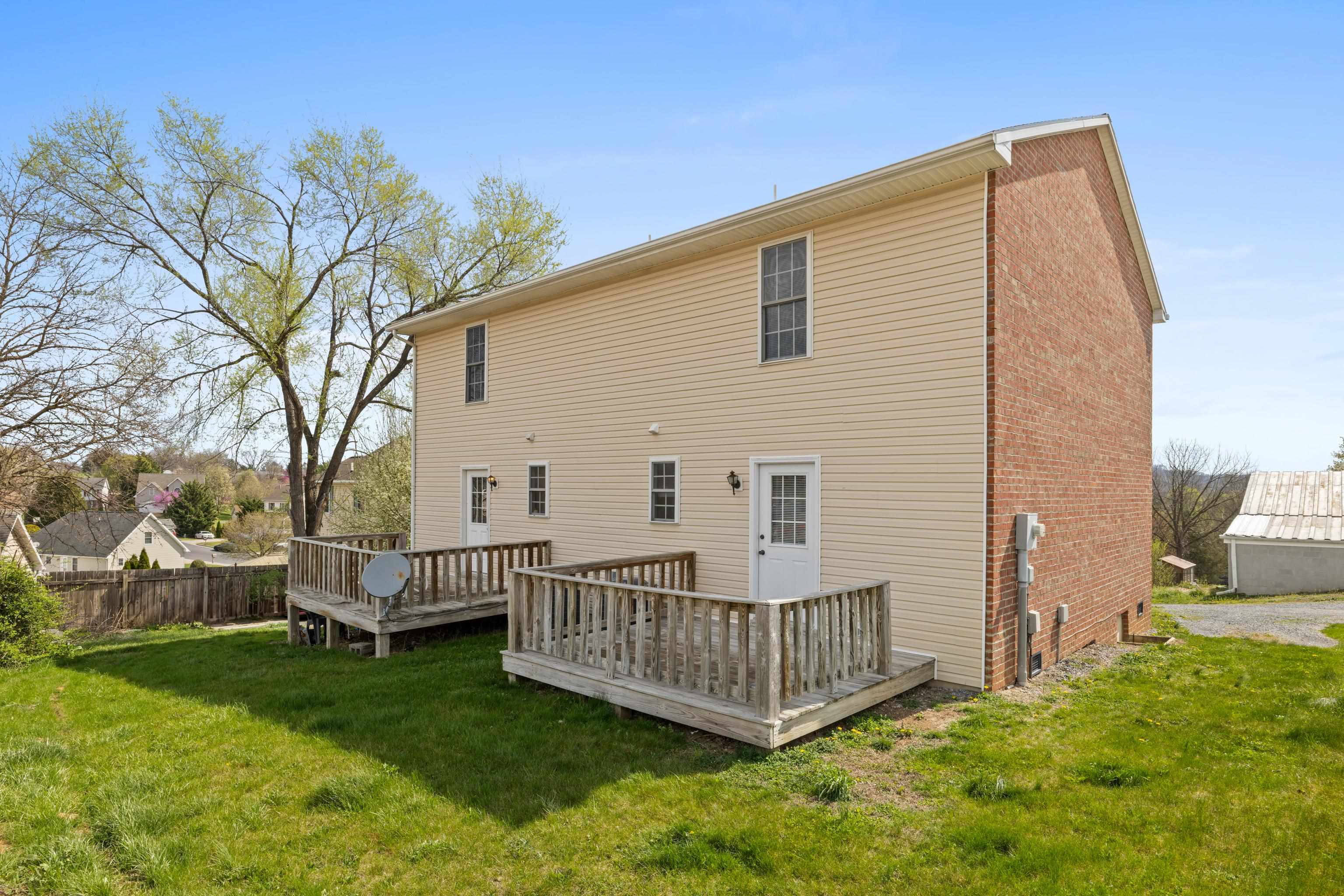 108 Pleasant Hill Road, Unit A & B Harrisonburg, VA 22801 - Photo 43 of 65 a view of a house with a yard and deck