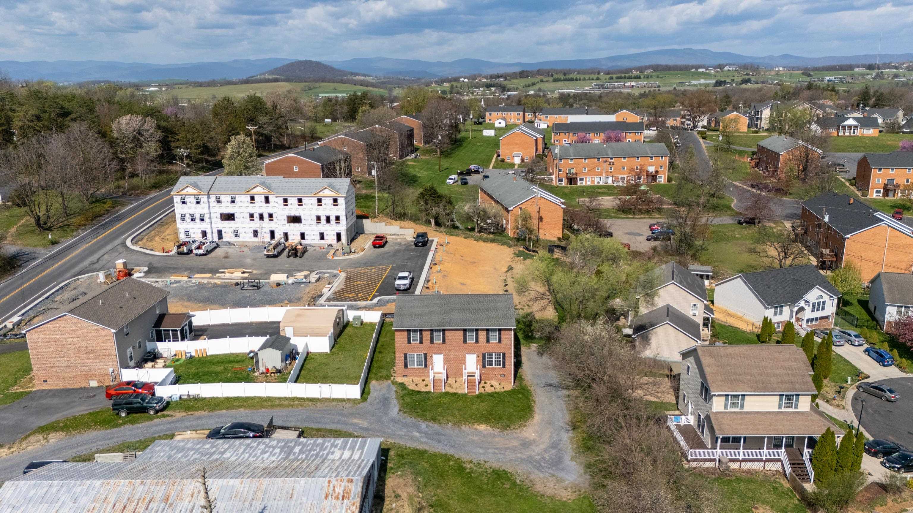 108 Pleasant Hill Road, Unit A & B Harrisonburg, VA 22801 - Photo 62 of 65 an aerial view of residential houses with outdoor space and parking