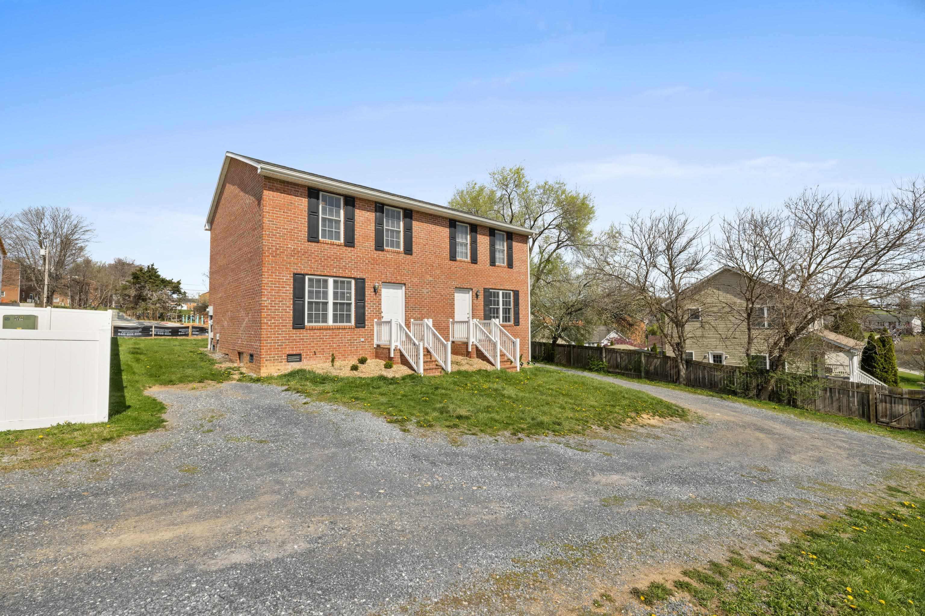 108 Pleasant Hill Road, Unit A & B Harrisonburg, VA 22801 - Photo 7 of 65 a front view of a house with a yard and garage