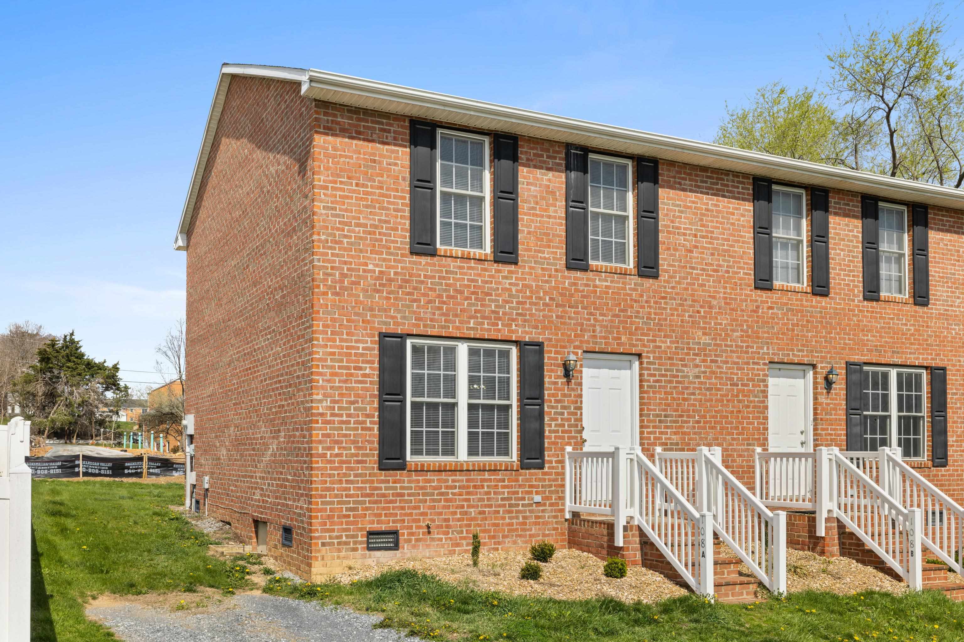 108 Pleasant Hill Road, Unit A & B Harrisonburg, VA 22801 - Photo 8 of 65 a front view of a house with a yard and garage