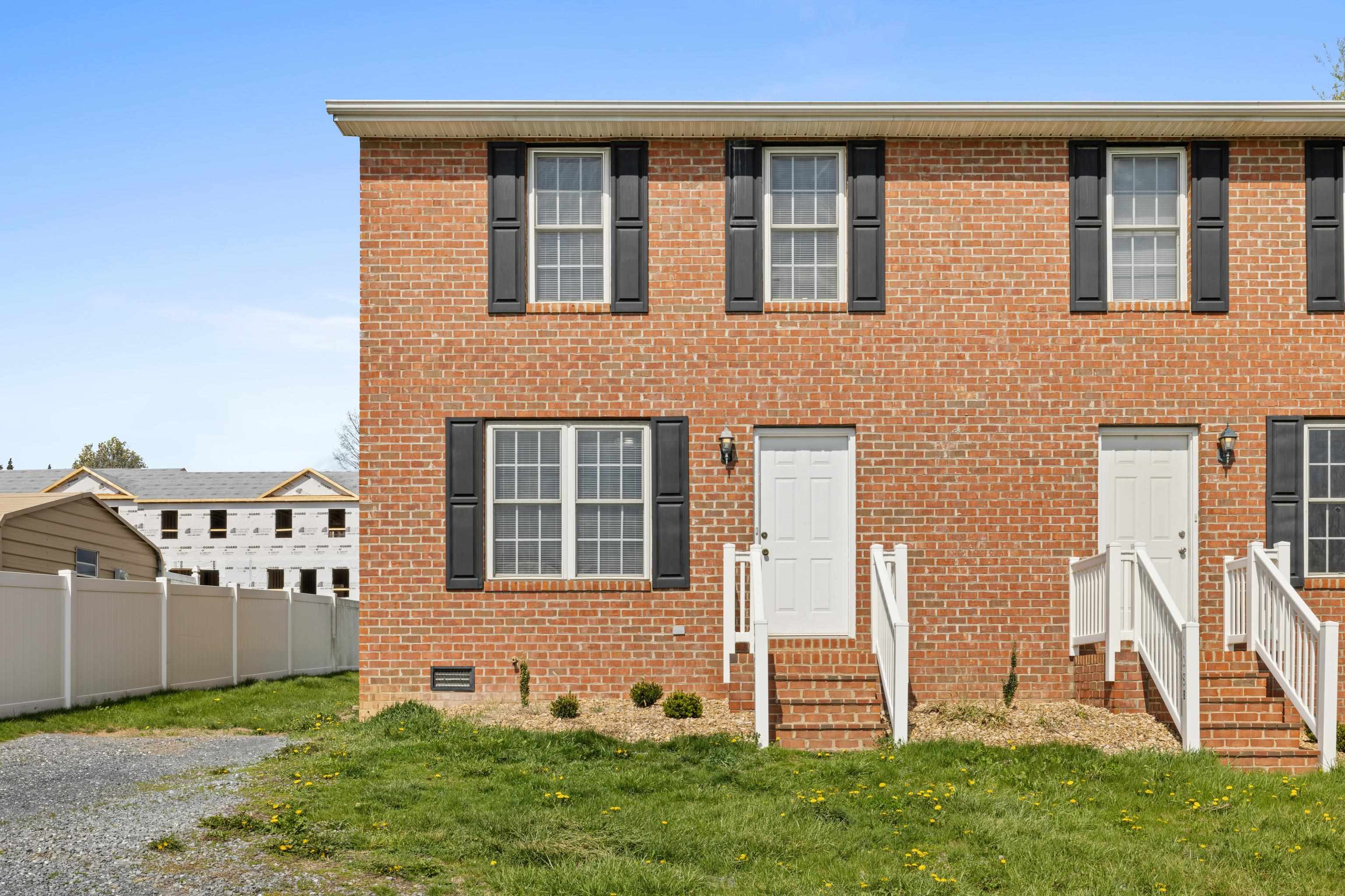 108 Pleasant Hill Road, Unit A & B Harrisonburg, VA 22801 - Photo 9 of 65 front view of a house with a yard