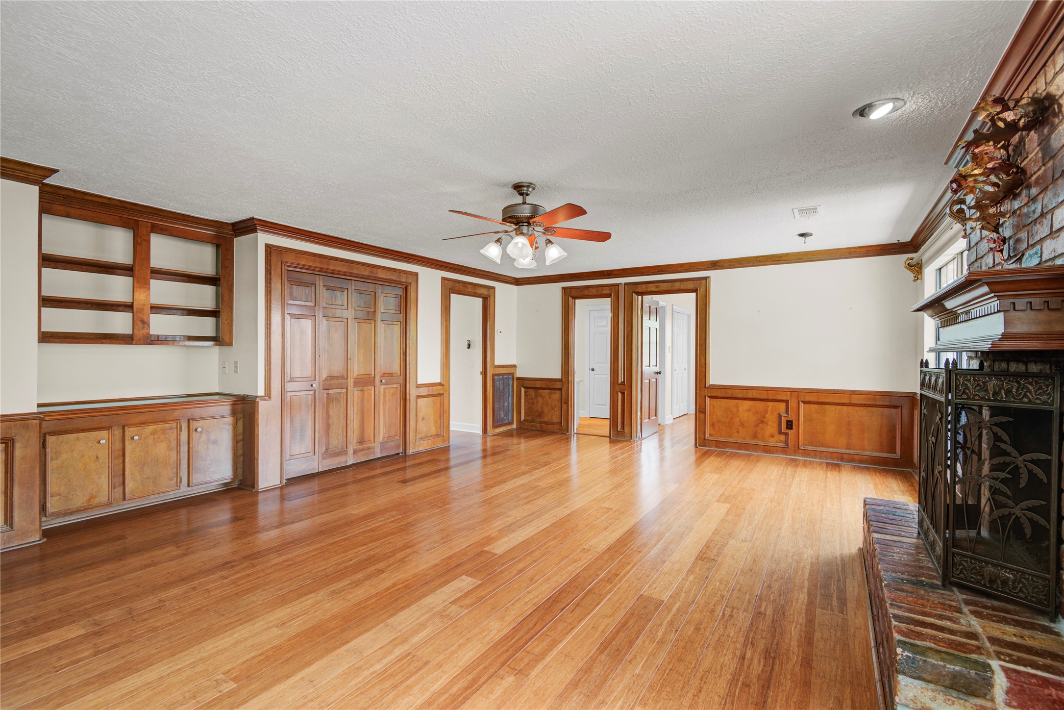 8412 Hidden Trail Lane Spring, TX 77379 - Photo 27 of 36 Spacious upstairs game room features bamboo flooring, a second fireplace, built-in wet bar, and plenty of room for entertaining.