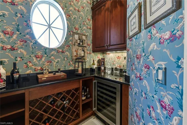 a kitchen with stainless steel appliances and cabinets