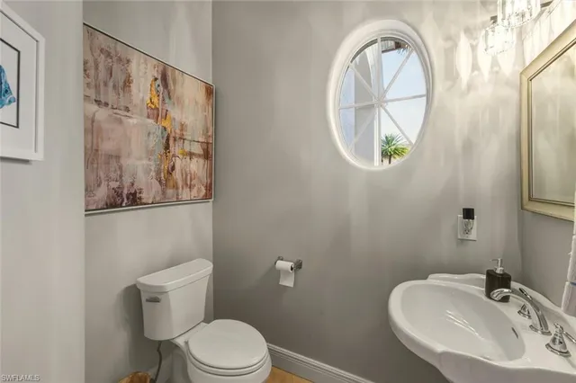 a bathroom with a toilet and a sink