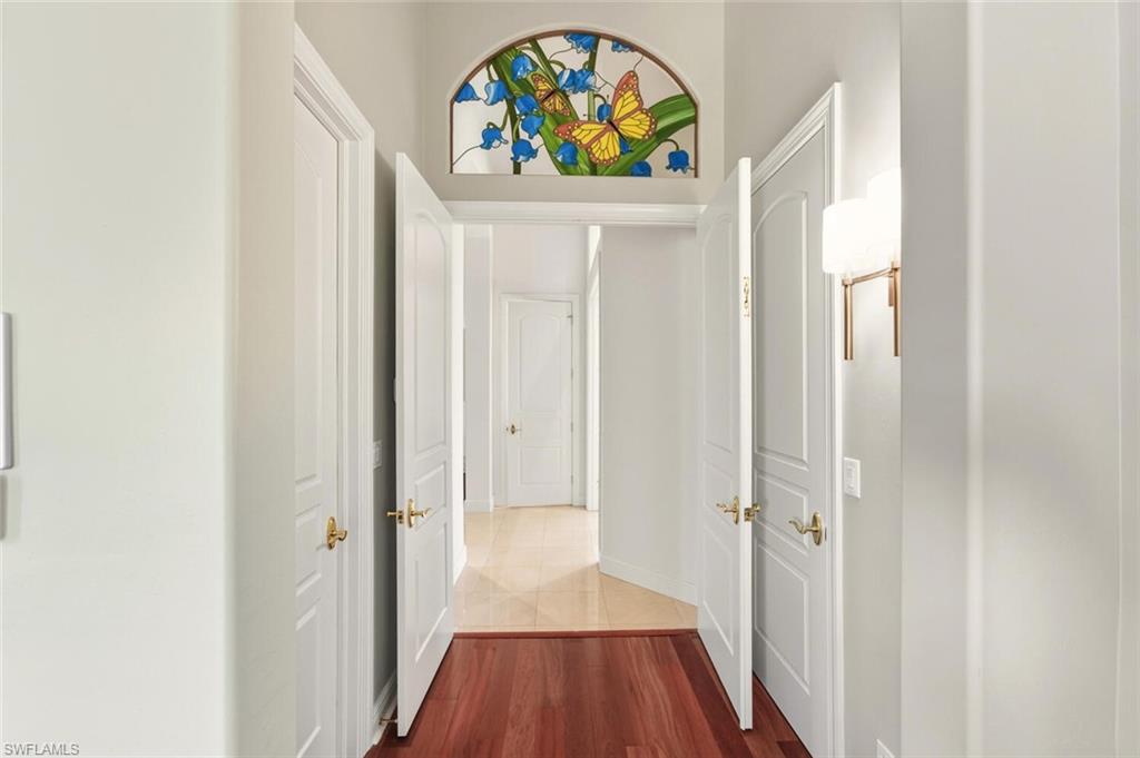 396 Terracina Way Naples, FL 34119 - Photo 35 of 50 Hall with dark wood-style flooring