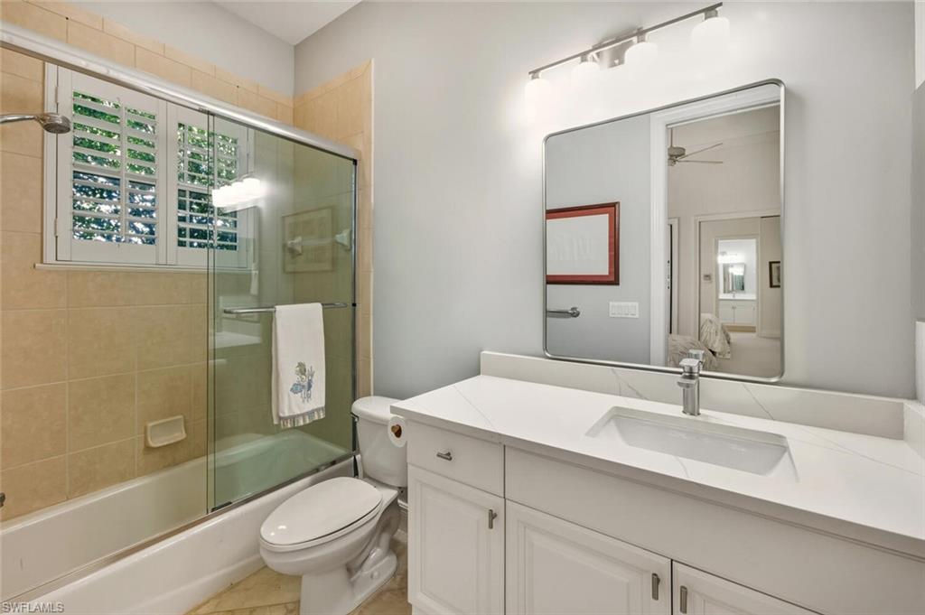396 Terracina Way Naples, FL 34119 - Photo 41 of 50 Full bath featuring vanity, enclosed tub / shower combo, and ceiling fan
