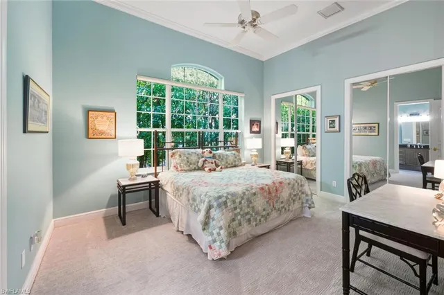 a living room with a bed furniture and a window