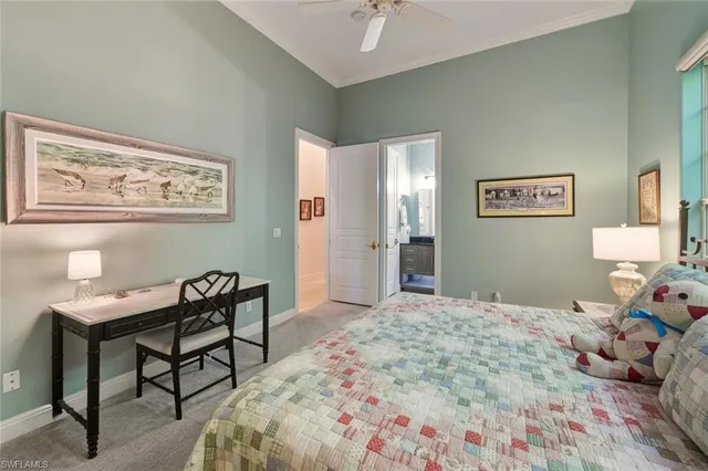 a bedroom with a bed and a table in it