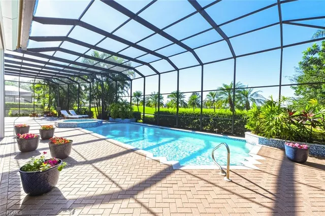 a view of a swimming pool with a patio