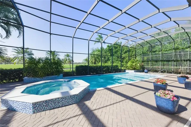 a swimming pool view with a backyard space