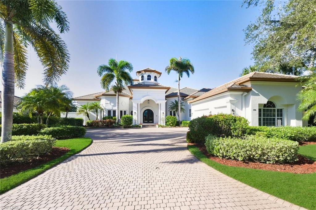 396 Terracina Way Naples, FL 34119 - Photo 6 of 50 Mediterranean / spanish-style home with stucco siding and decorative driveway