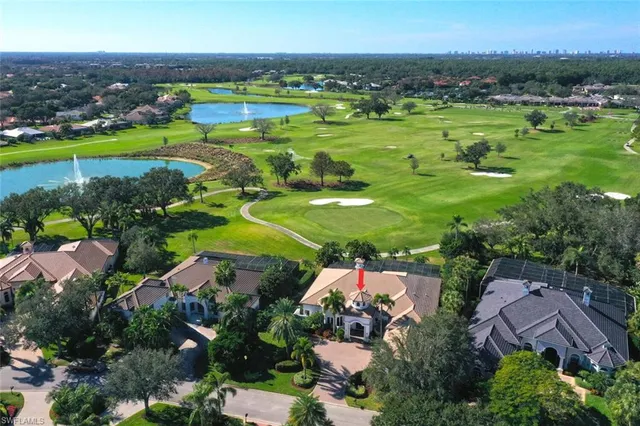 an aerial view of a houses with outdoor space and lake view