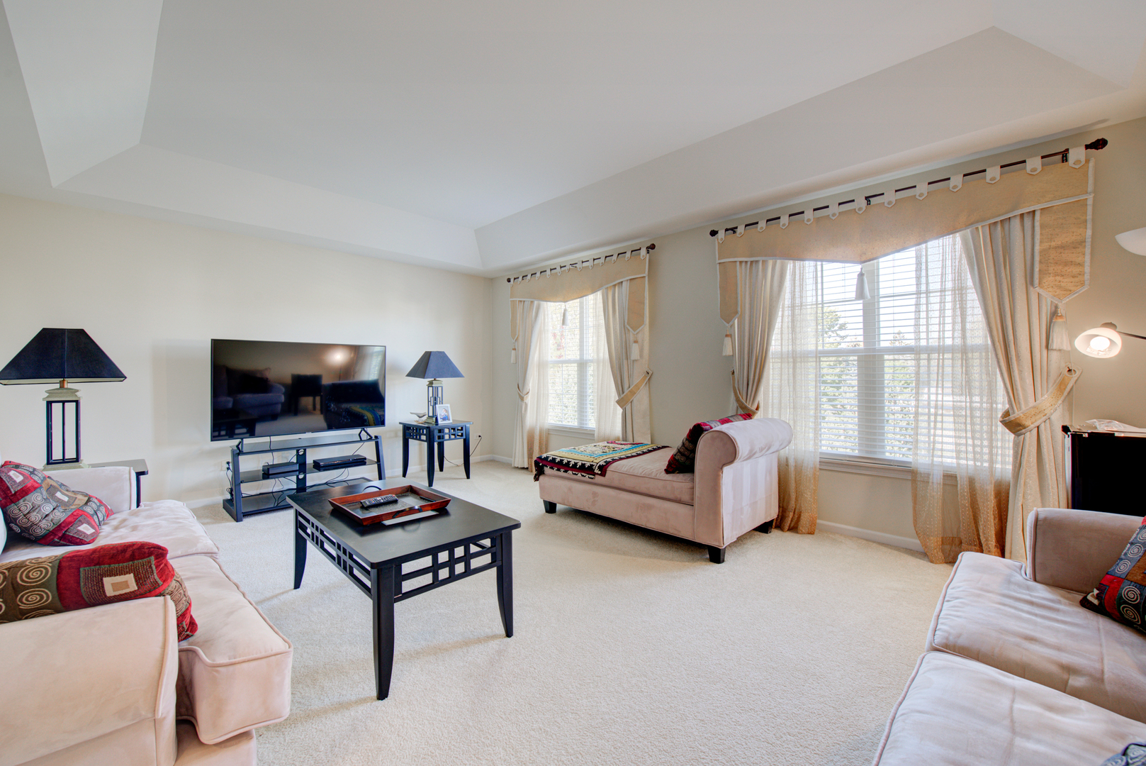 24520 Rockefeller Court Plainfield, IL 60544 - Photo 18 of 57 a living room with furniture and a flat screen tv
