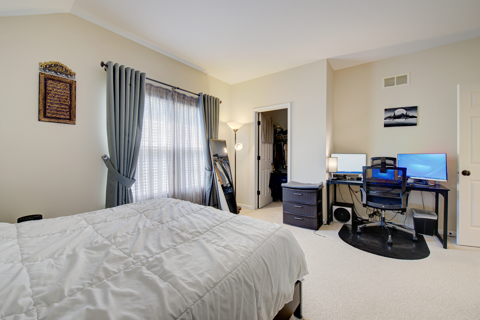 24520 Rockefeller Court Plainfield, IL 60544 - Photo 24 of 57 a bedroom with a bed and a desk