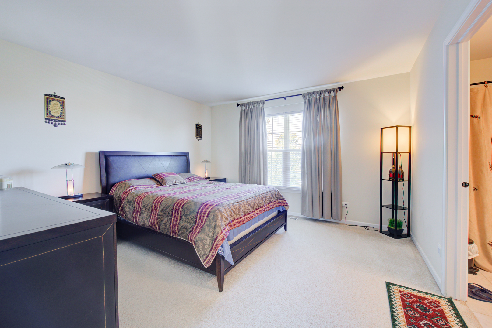 24520 Rockefeller Court Plainfield, IL 60544 - Photo 27 of 57 a spacious bedroom with a bed and a cabinets