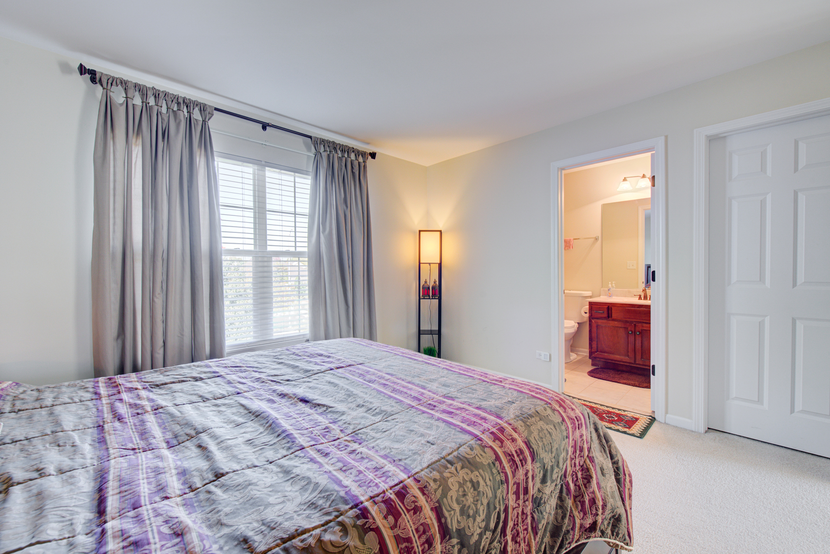 24520 Rockefeller Court Plainfield, IL 60544 - Photo 28 of 57 a bedroom with a bed and a window