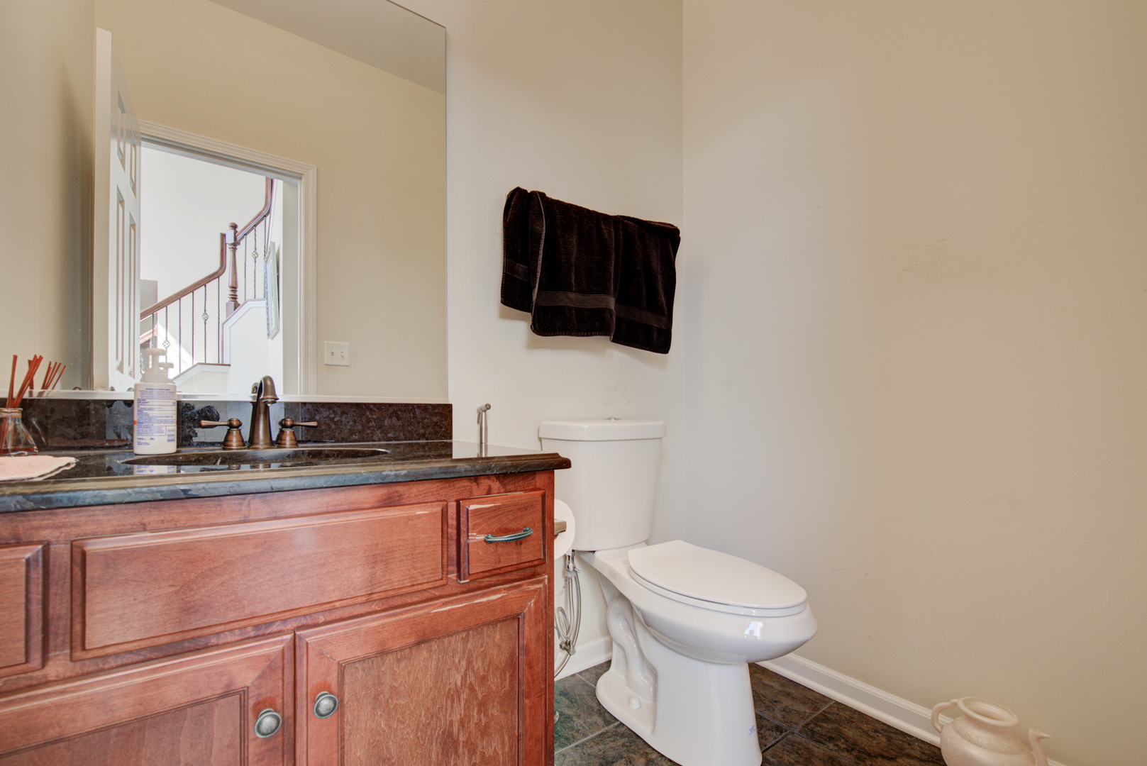 24520 Rockefeller Court Plainfield, IL 60544 - Photo 38 of 57 a bathroom with a toilet a sink and mirror